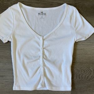 Hollister ladies tee. White. Button snap. Ribbed. Size small. Good shape.